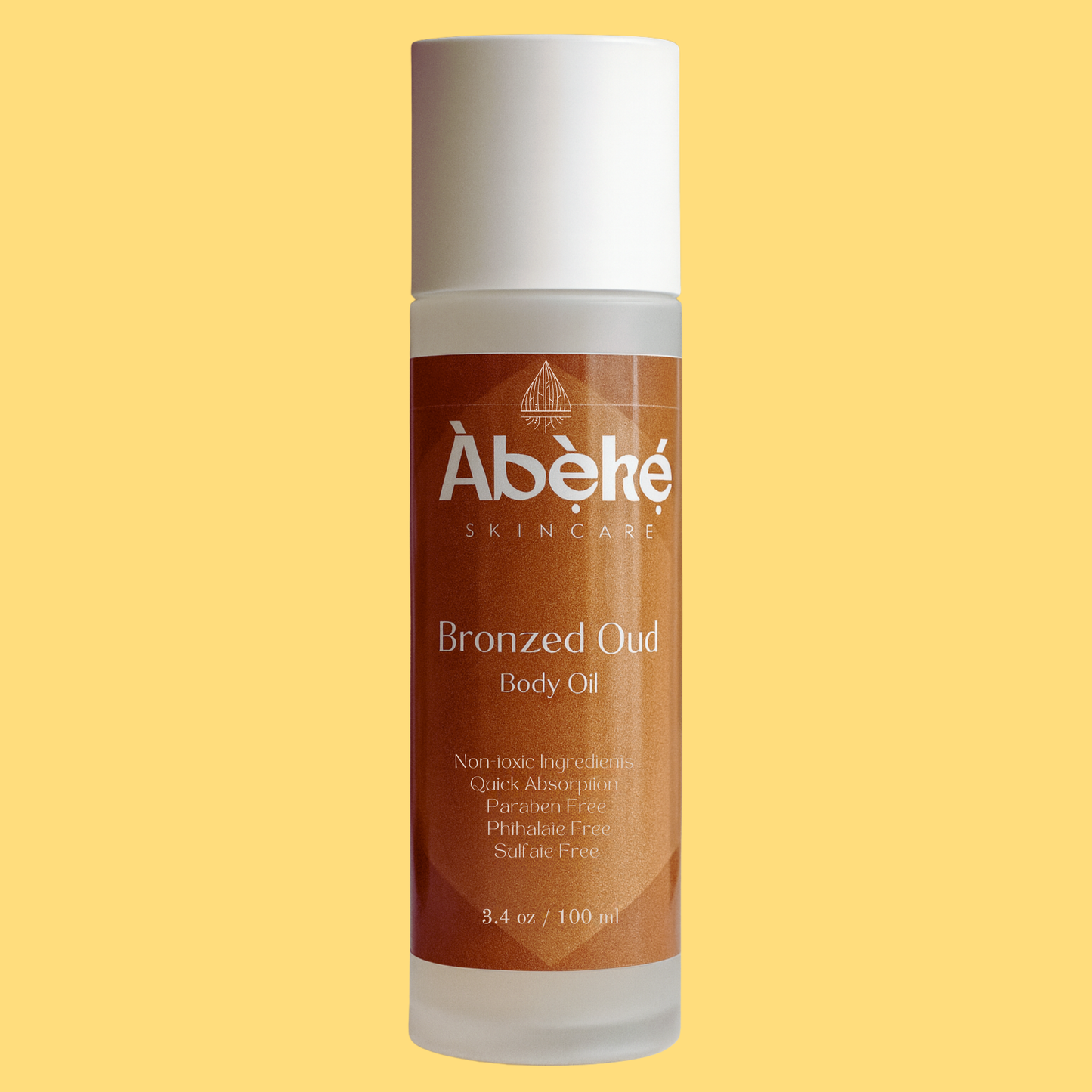 Abeke Bronzed Oud body oil bottle on a yellow background