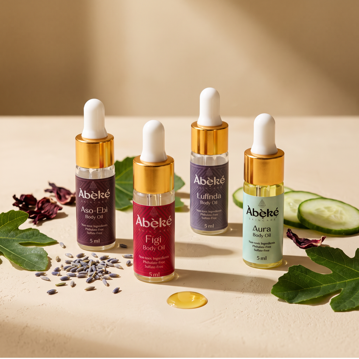 Fresh & Floral Fall Body Oil Discovery Set: four 5 ml Àbẹ̀kẹ́ body oils in Àsò Èbí, Fígi, Luffinda and Aura with cucumber, lavender and fig leaves