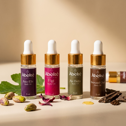 Warm & Cozy Fall Body Oil Discovery Set: four 5 ml Àbẹ̀kẹ́ body oils in Àsò Èbí, Fígi, Àjé Butta and Bronzed Oud with pistachios, hibiscus and fig leaves